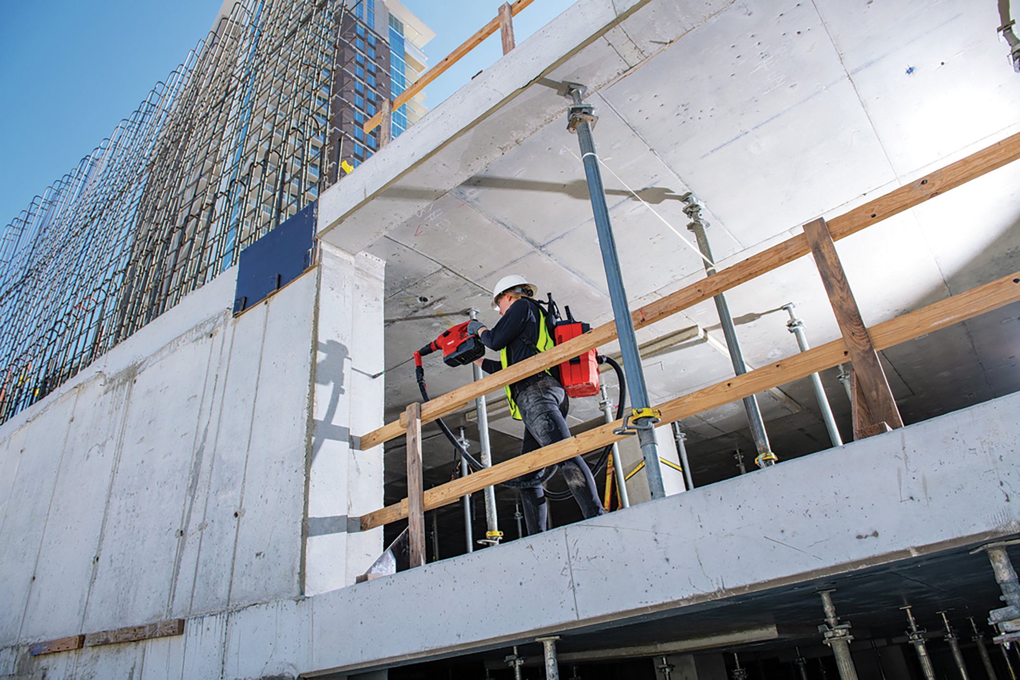 Construction worker using dust extraction systems