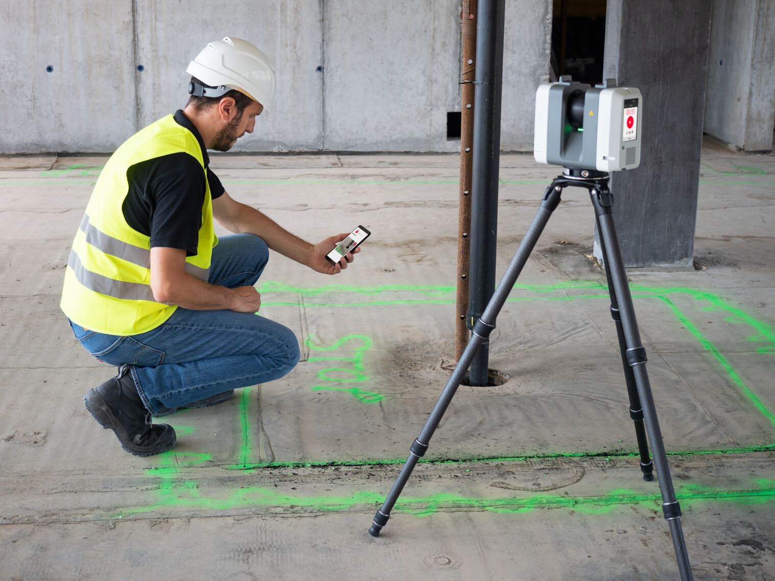 Construction worker using Leica laser scanner