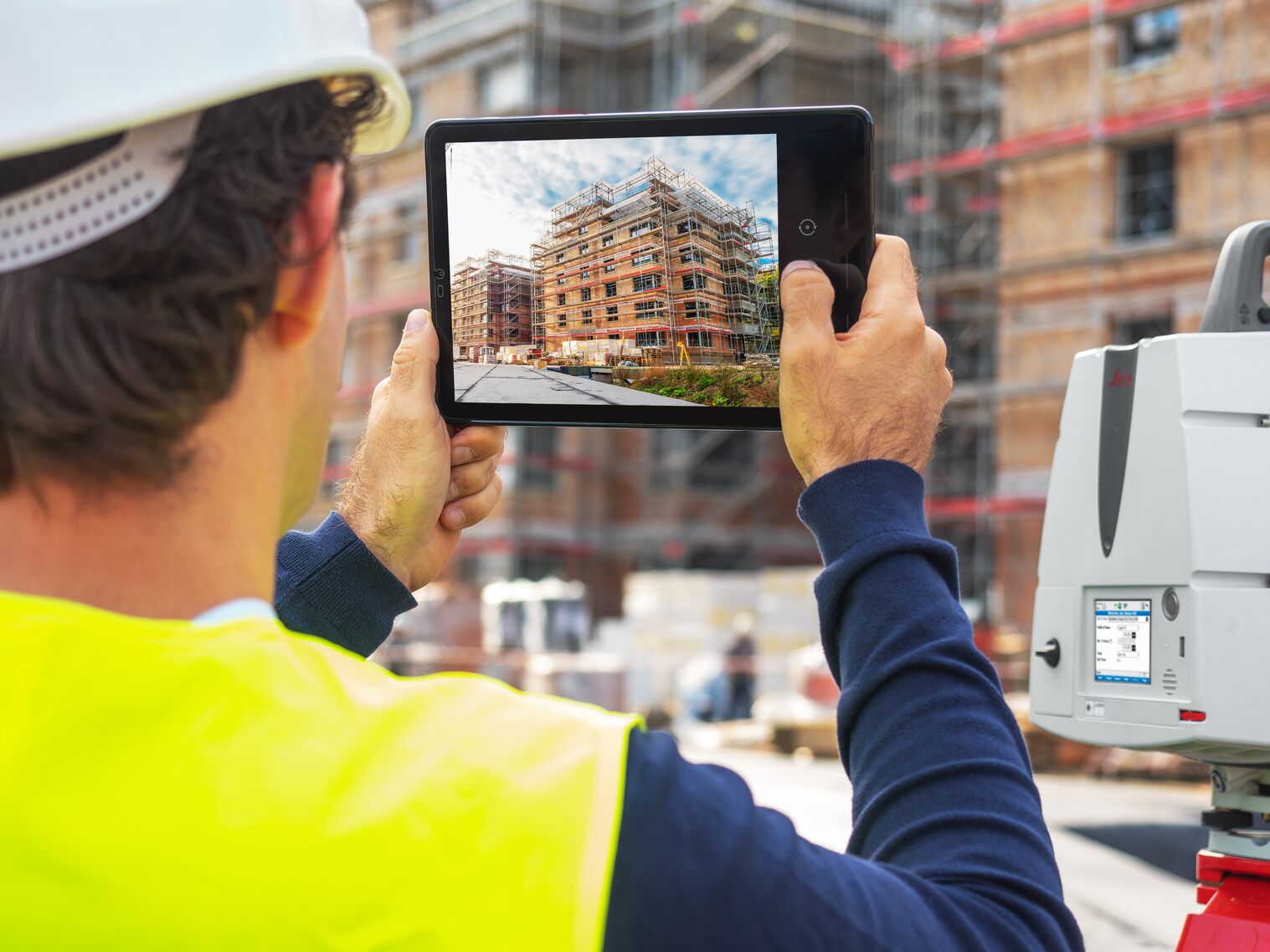 construction worker using virtual design and construction app