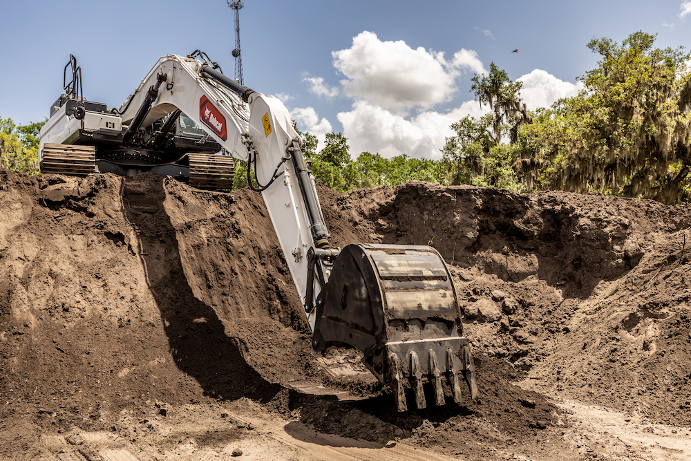 Bobcat excavator digging on jobsite