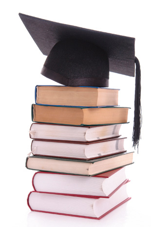 stack of books and a graduation cap