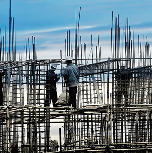 Construction workers on scaffolding