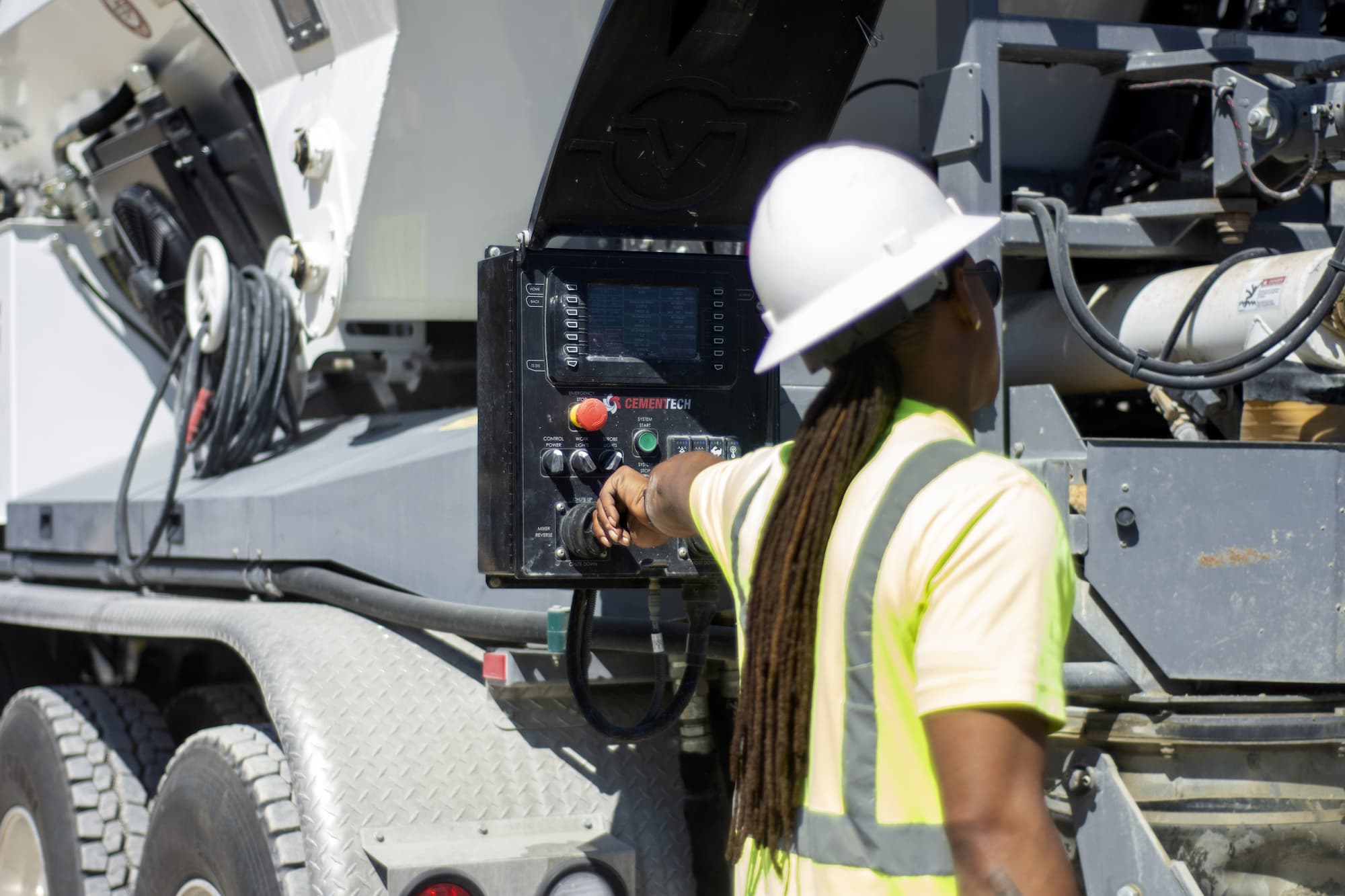 Construction worker operating equipment