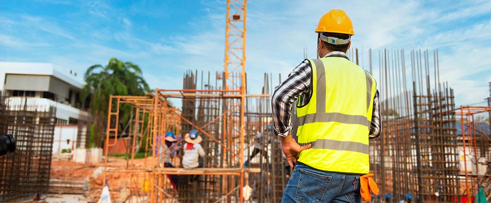 Construction worker looking at site