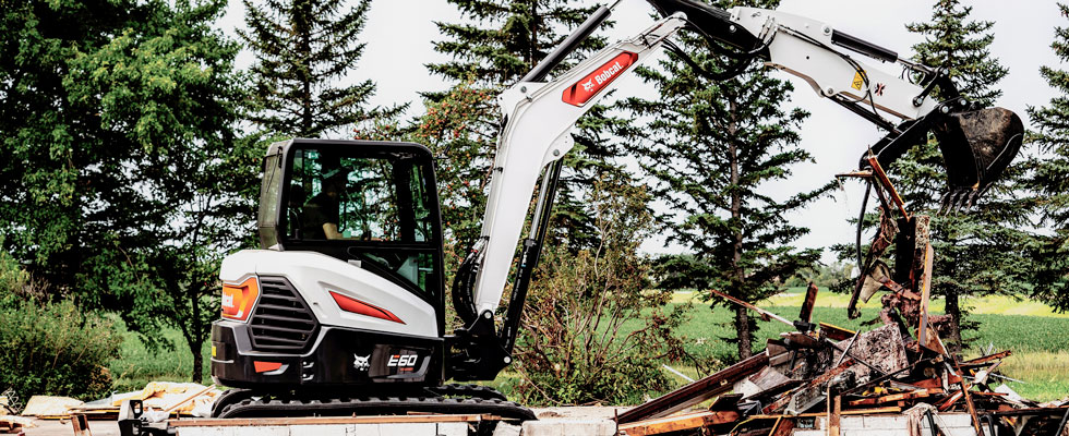 A bobcat excavator goes to work.