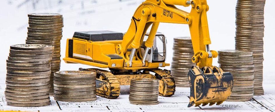Toy excavator by rows of coins to represent construction financial options