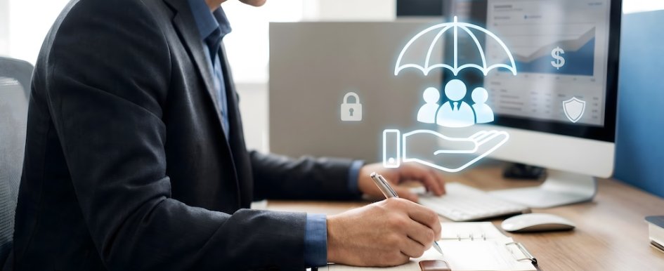 Businessman reviewing insurance coverage on computer