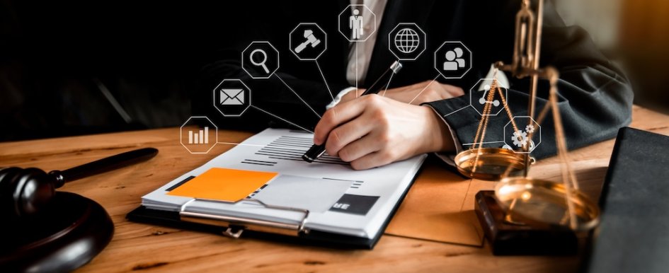person signing legal documents at desk