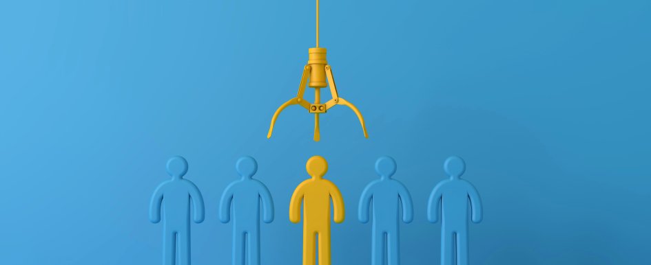 Image of employee being picked by machine/Adobe Stock
