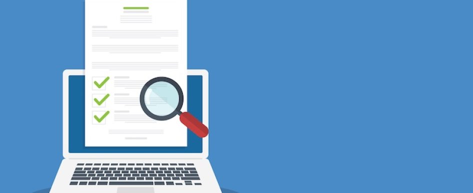 Laptop displaying checklist under magnifying glass