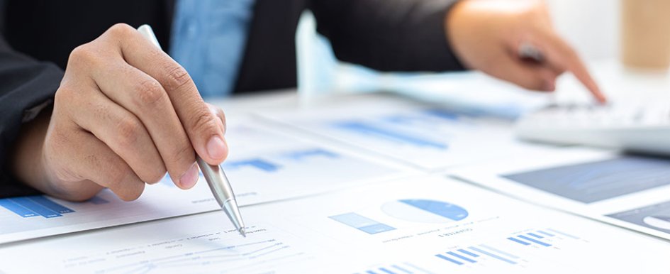 Hands doing paperwork/Adobe Stock