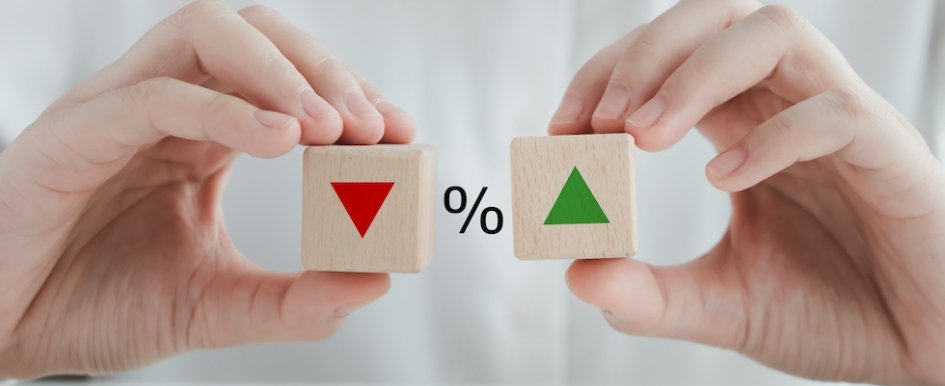 Percentage symbol between down arrow and up arrow to indicate interest rates holding 