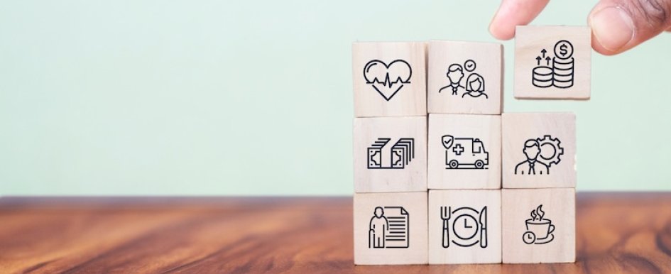 Stacked blocks illustrating employee benefits and insurance