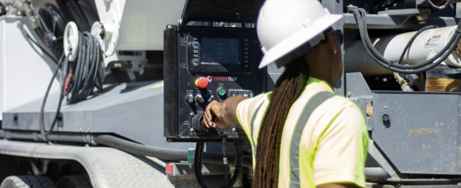 Construction worker operating equipment