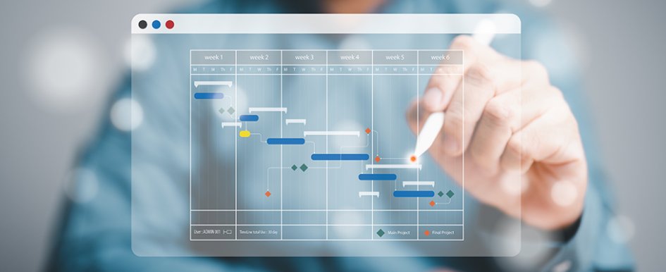 Hand with stylus touching tech schedule 