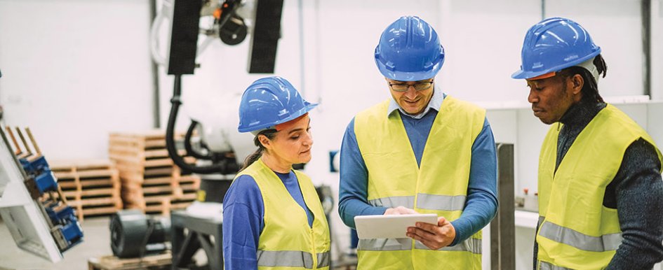 Three construction workers representing multigenerational team