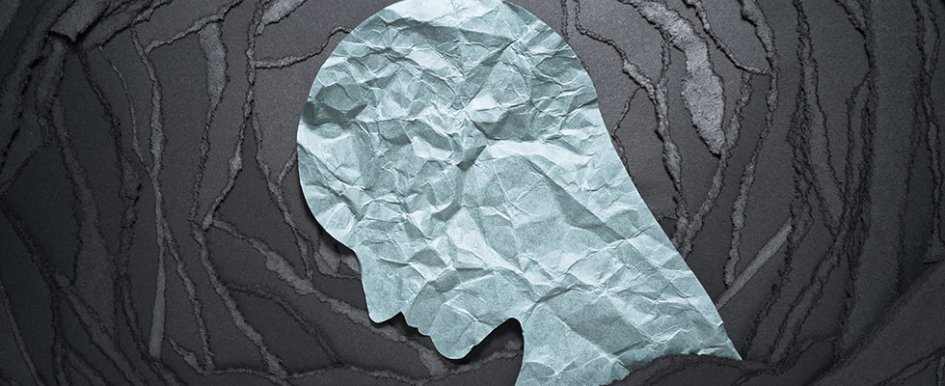 Silhouette of a head on a black background/Adobe Stock