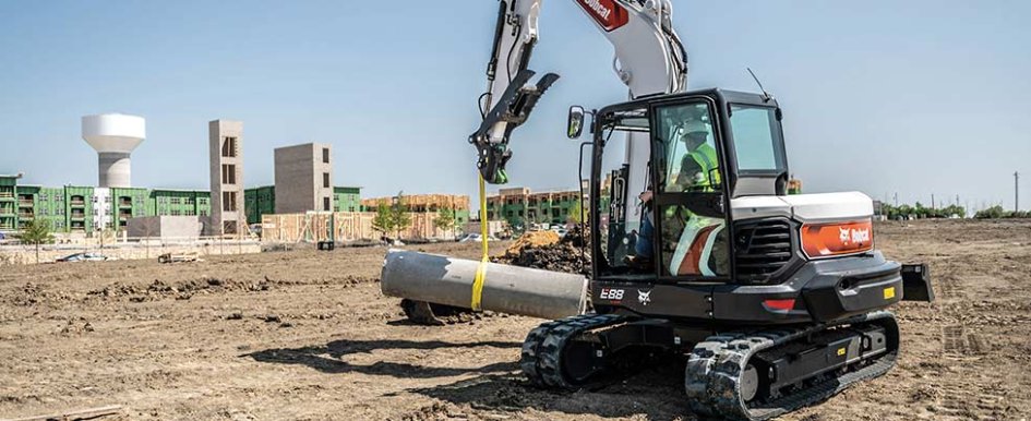 Bobcat excavator moving material on jobsite