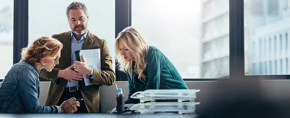 3 people meeting in an office