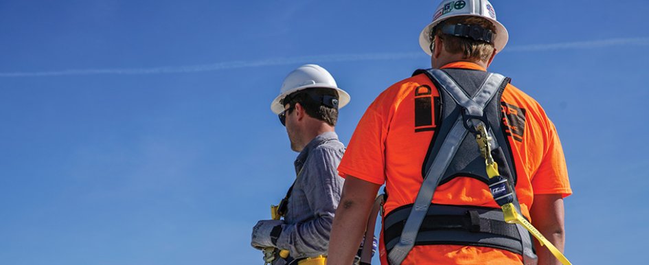 Workers wearing safety equipment