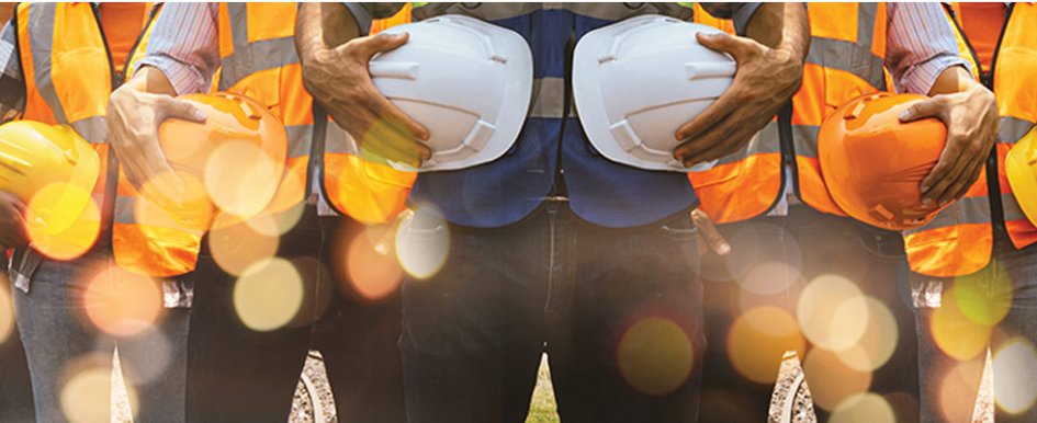 People holding hard hats to represent ESOP (Employee Stock Ownership Plans)/Adobe Stock