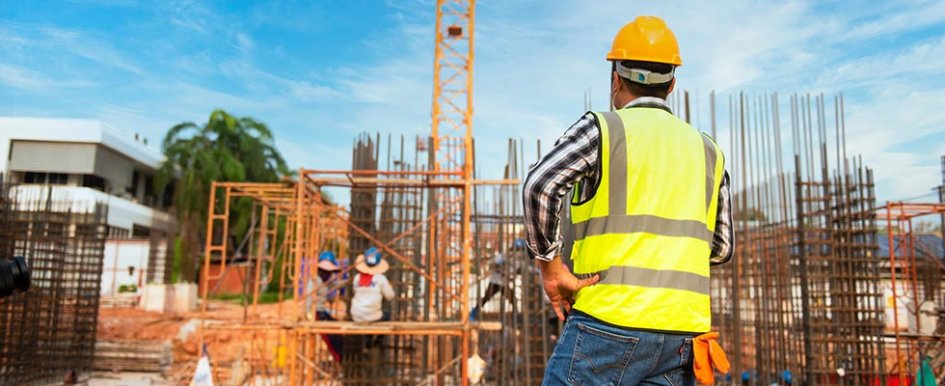 Construction worker looking at site