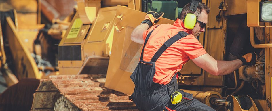 Man in PPE working on equipment