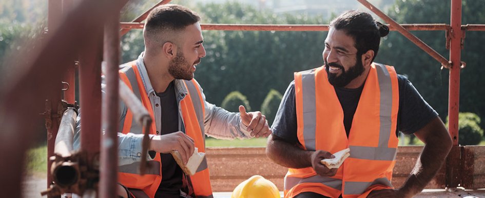 Two workers talking and smiling