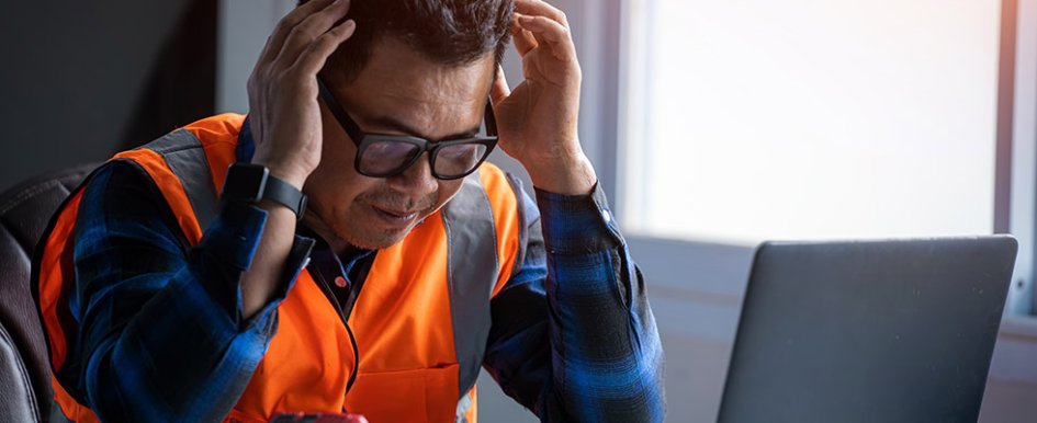 Man holding head as if frustrated