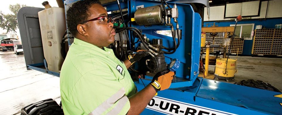 Man working on United Rentals machine