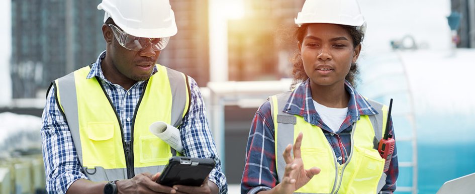 two construction workers talking