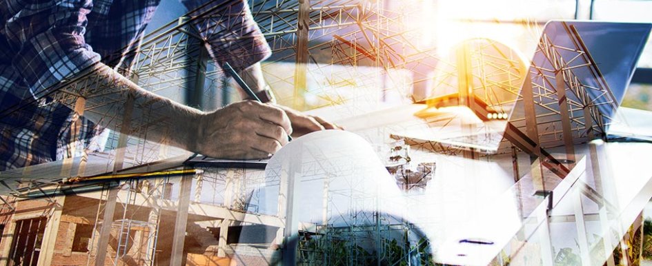 A person writes on a notepad next to a laptop. A translucent overlay of scaffolding can be seen.