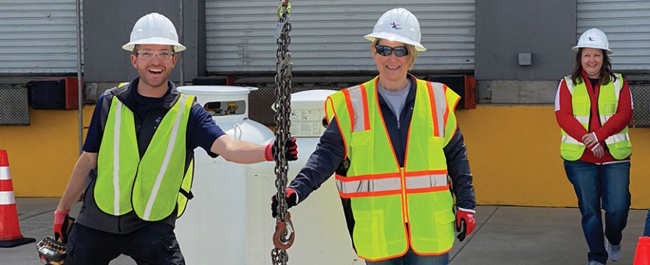 Three construction workers smiling