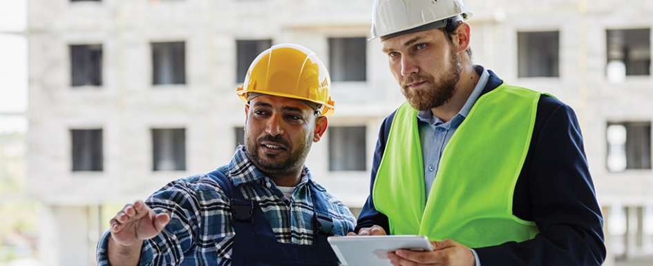 Two workers/Adobe Stock