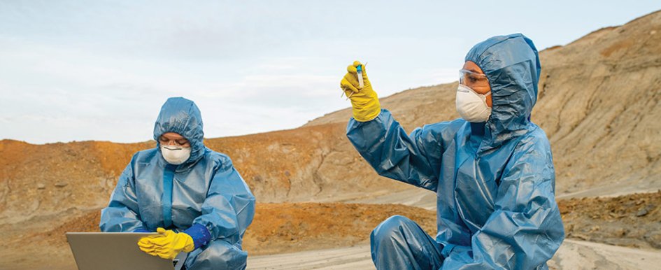 Workers in PPE/Adobe Stock