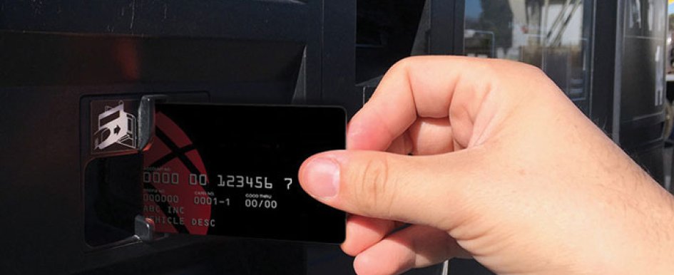 Person Putting Credit Card in ATM