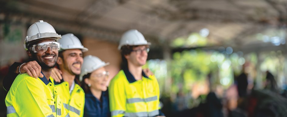 People in hard hats and vests/ Adobe Stock