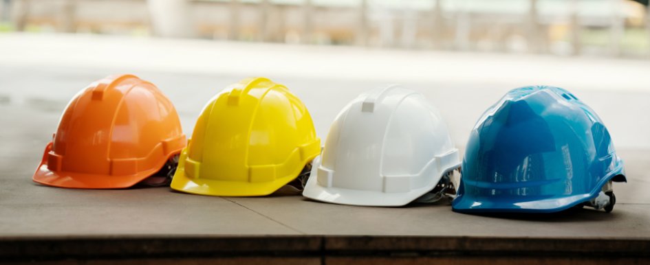 row of construction safety helmets