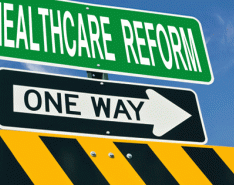 Image of Signs with the words "Healthcare Reform" and "One Way"