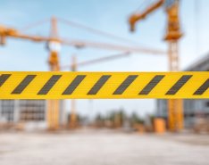 Construction site blocked by yellow caution tape