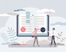 People reviewing decisions in large book