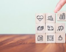 Stacked blocks illustrating employee benefits and insurance