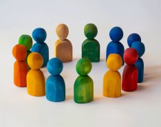 block figure people in a huddle