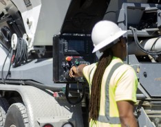Construction worker operating equipment