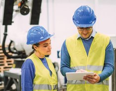 Three construction workers representing multigenerational team