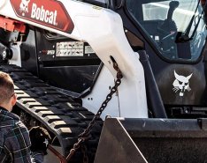 Person working on Bobcat machine