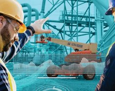 Construction workers looking at fleet app courtesy of JLG