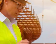 Construction worker looking at screen