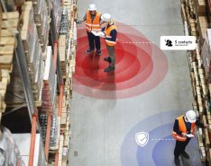 Three men in a warehouse