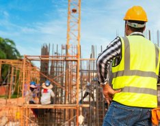 Construction worker looking at site